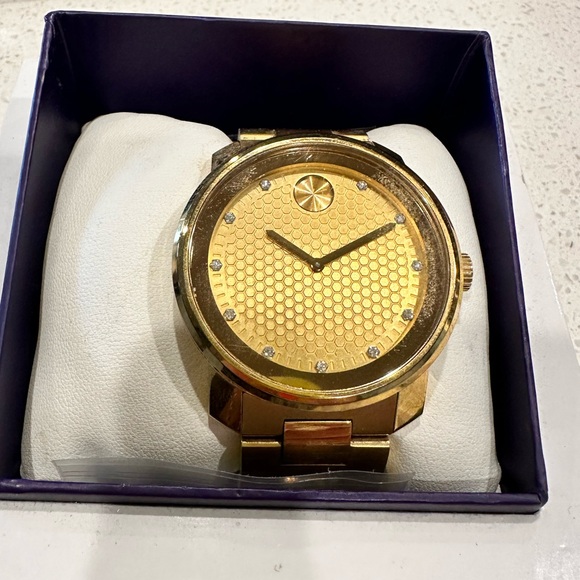 Movado gold and diamond watch. - Picture 1 of 12